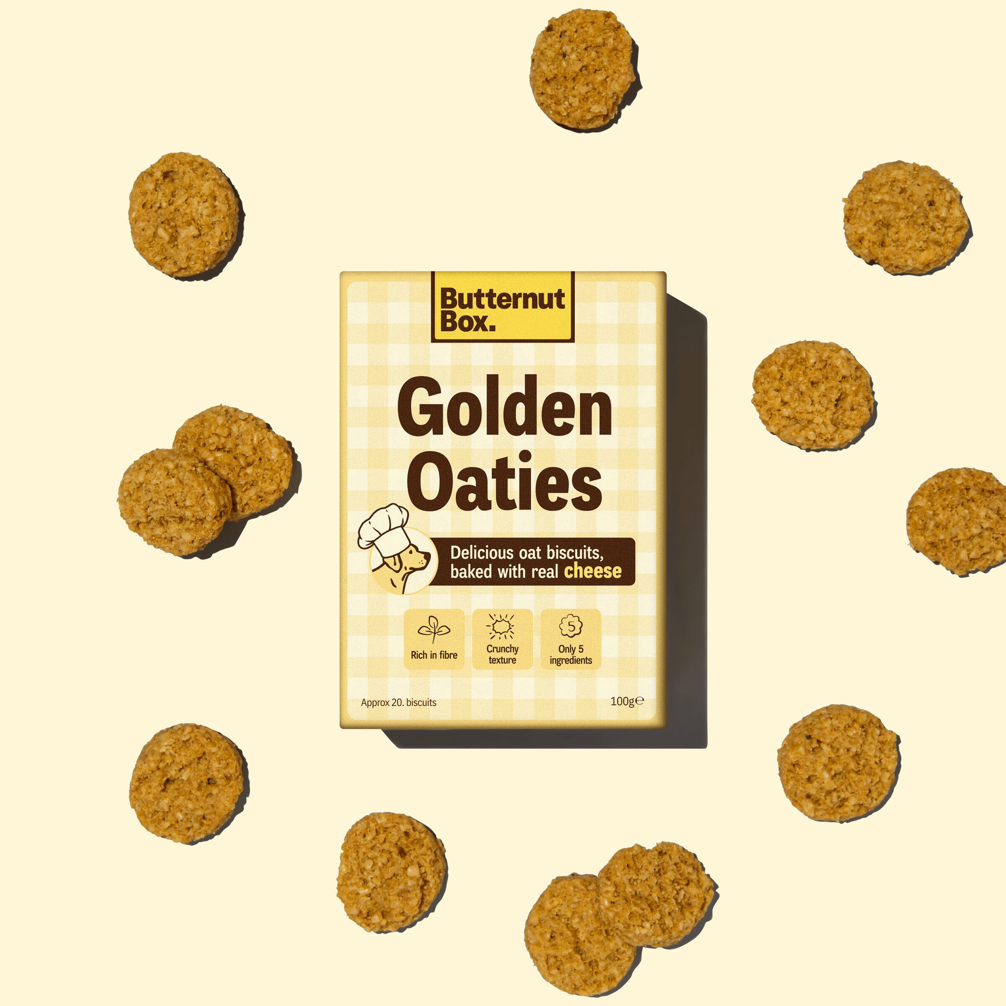 Butternut Box Golden Oaties package surrounded by oat biscuits, highlighting rich fiber, crunchy texture, and made with only 5 ingredients.